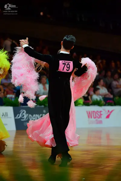 Dancesport competitor: Male dancer: black suit