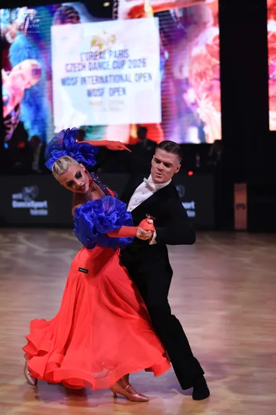 Dancesport competitor: Male dancer: black suit with a white shirt and black bow tie