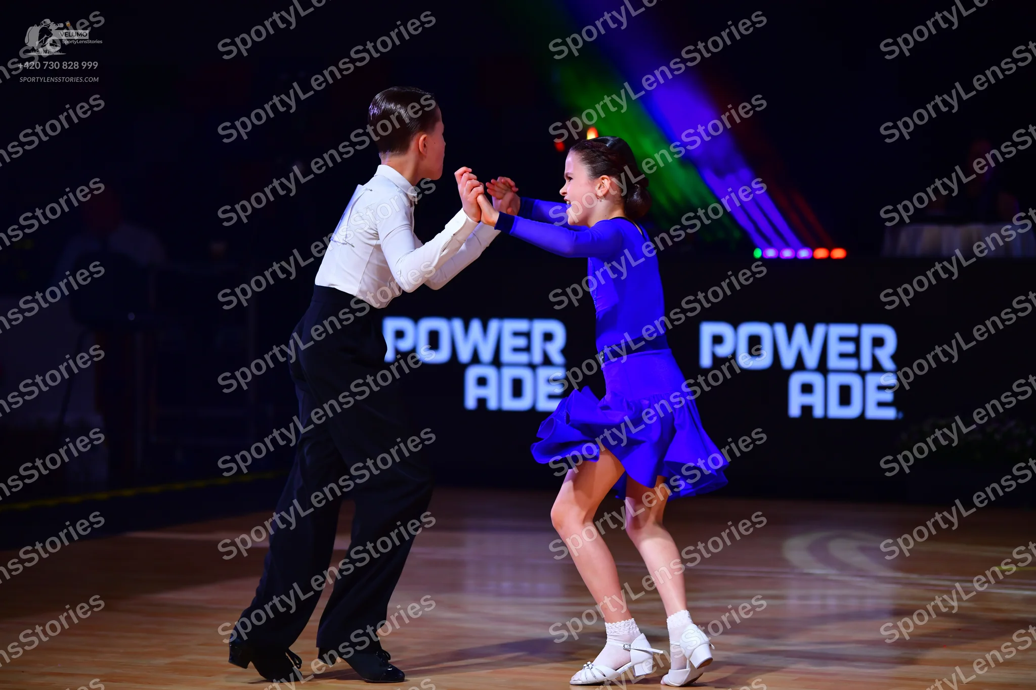 Dancesport competitor: Male dancer: white long-sleeved shirt and black trousers