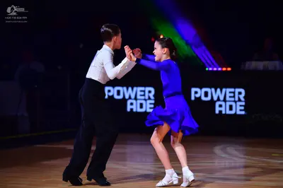 Dancesport competitor: Male dancer: white long-sleeved shirt and black trousers