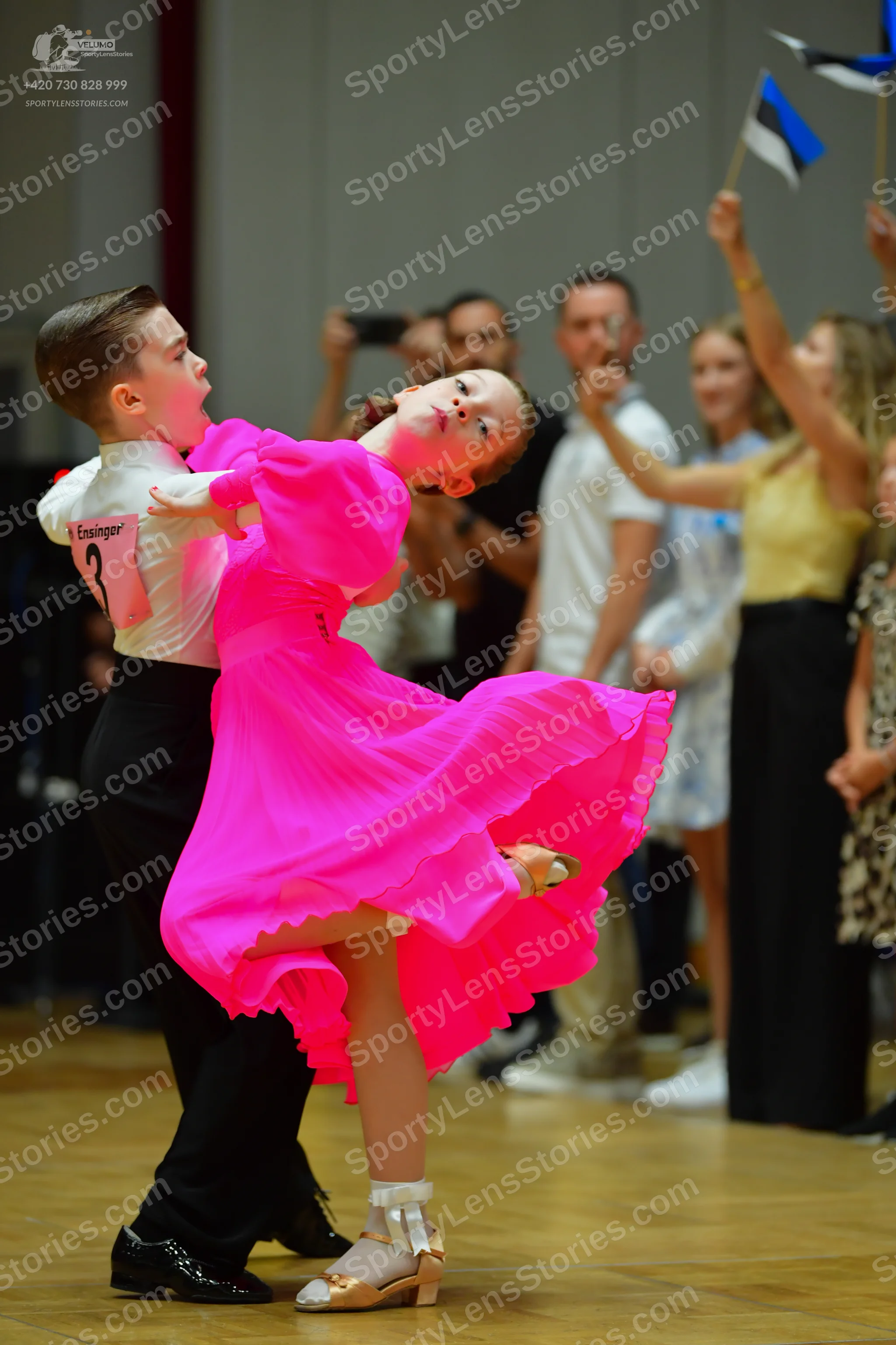 Dancesport competitor: Male dancer: white long-sleeved shirt and black trousers