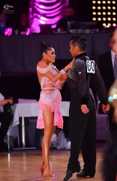 Dancesport competitor #60: Male dancer: black long-sleeved shirt with silver sequins and black trousers