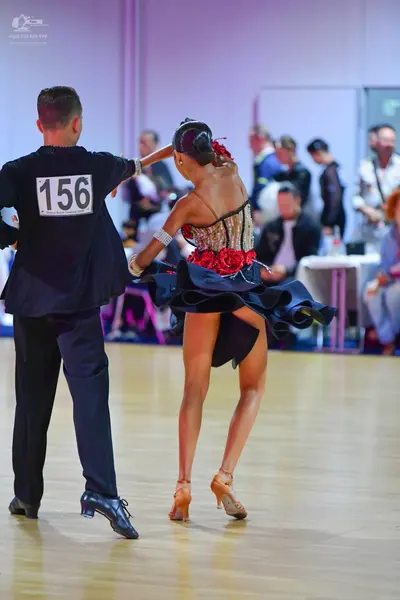 Dancesport competitor #156: Male dancer: black long-sleeved shirt and black trousers