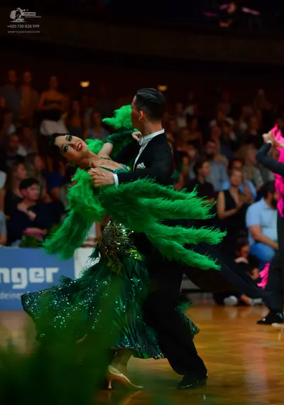 Dancesport competitor: Male dancer: black suit