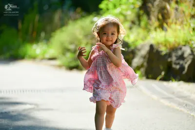 Dancesport competitor: Female dancer: pink and white checkered/gingham pattern dress with ruffles