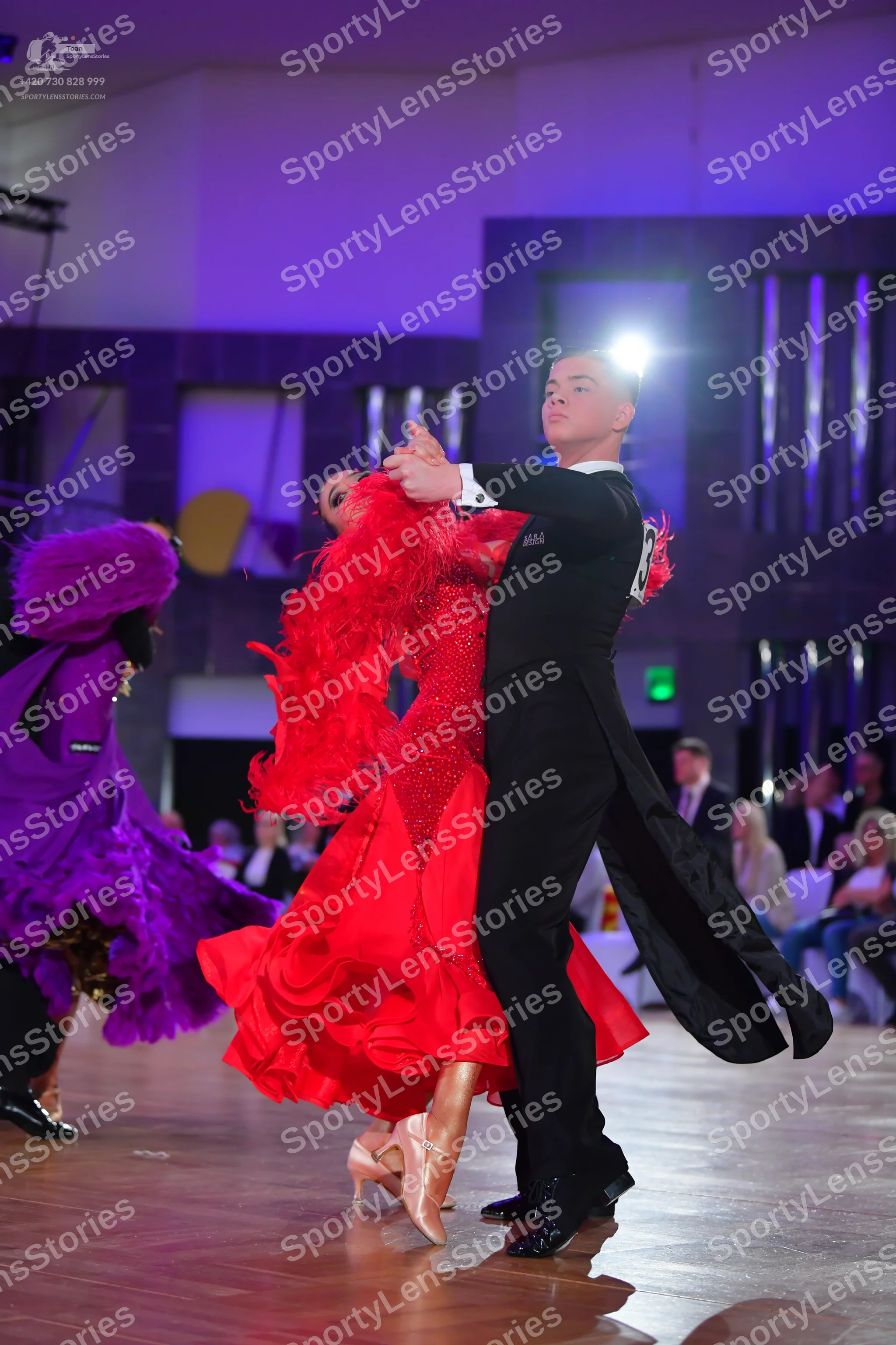 Dancesport competitor: Male dancer: black tailcoat suit with a white design on the back, black trousers