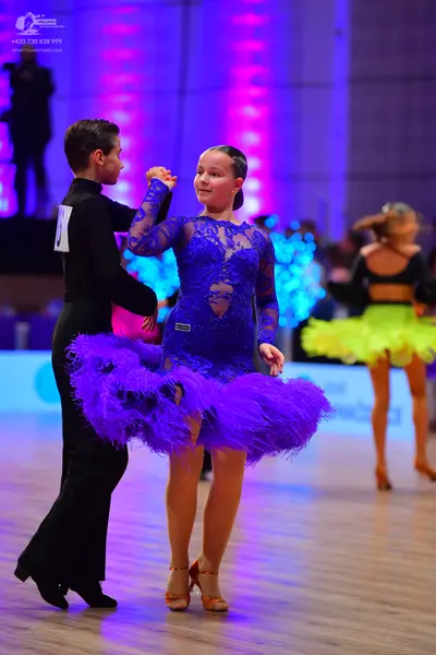 Dancesport competitor: Male dancer: black long-sleeved shirt and black trousers