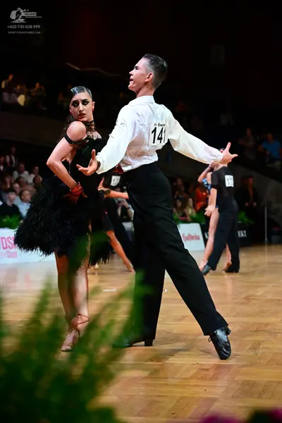 Dancesport competitor #141: Male dancer: white long-sleeved shirt and black trousers