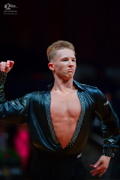 Dancesport competitor: Male dancer: black satin-like shirt with a deep V-neckline and sparkly crystal o
