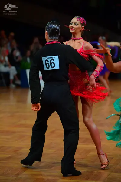 Dancesport competitor #66: Male dancer: black long-sleeved shirt and black trousers