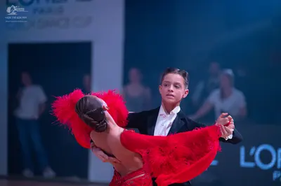 Dancesport competitor: Male dancer: black suit with a white shirt