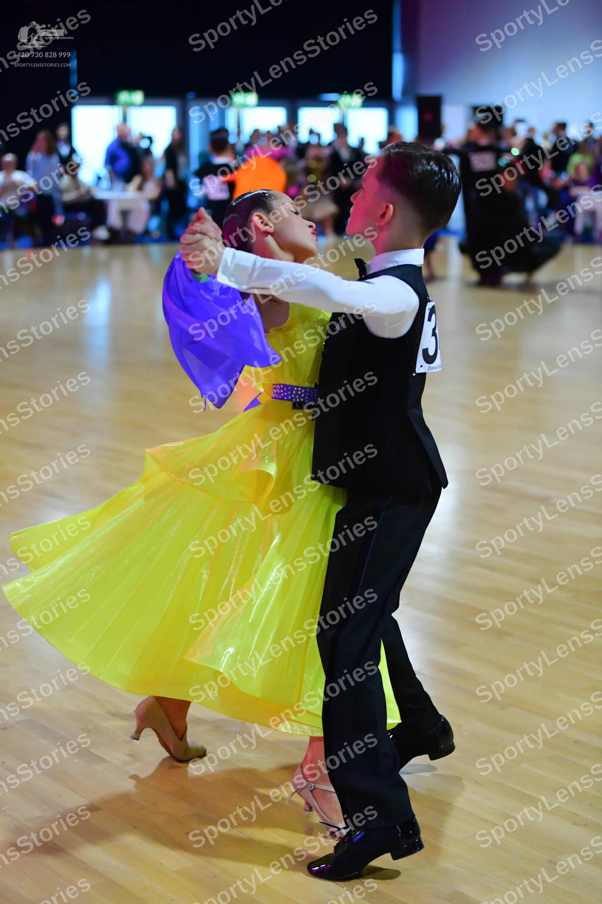 Dancesport competitor: Male dancer: black waistcoat, white long-sleeved shirt, black trousers, and blac