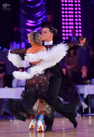 Dancesport competitor: Male dancer: black suit