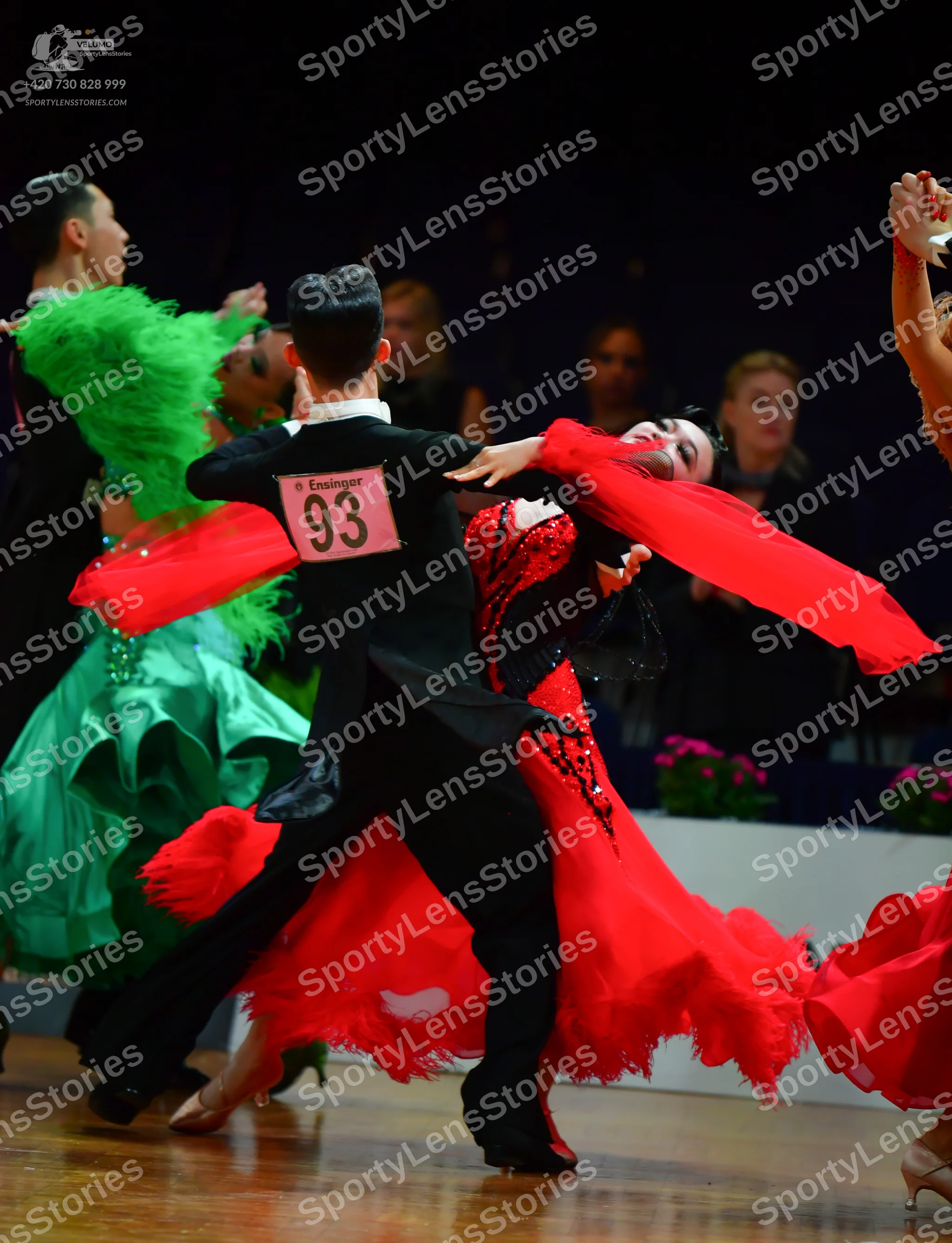 Dancesport competitor: Male dancer (center): black suit