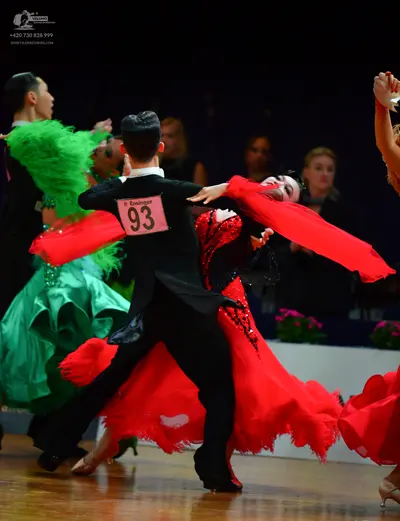 Dancesport competitor: Male dancer (center): black suit