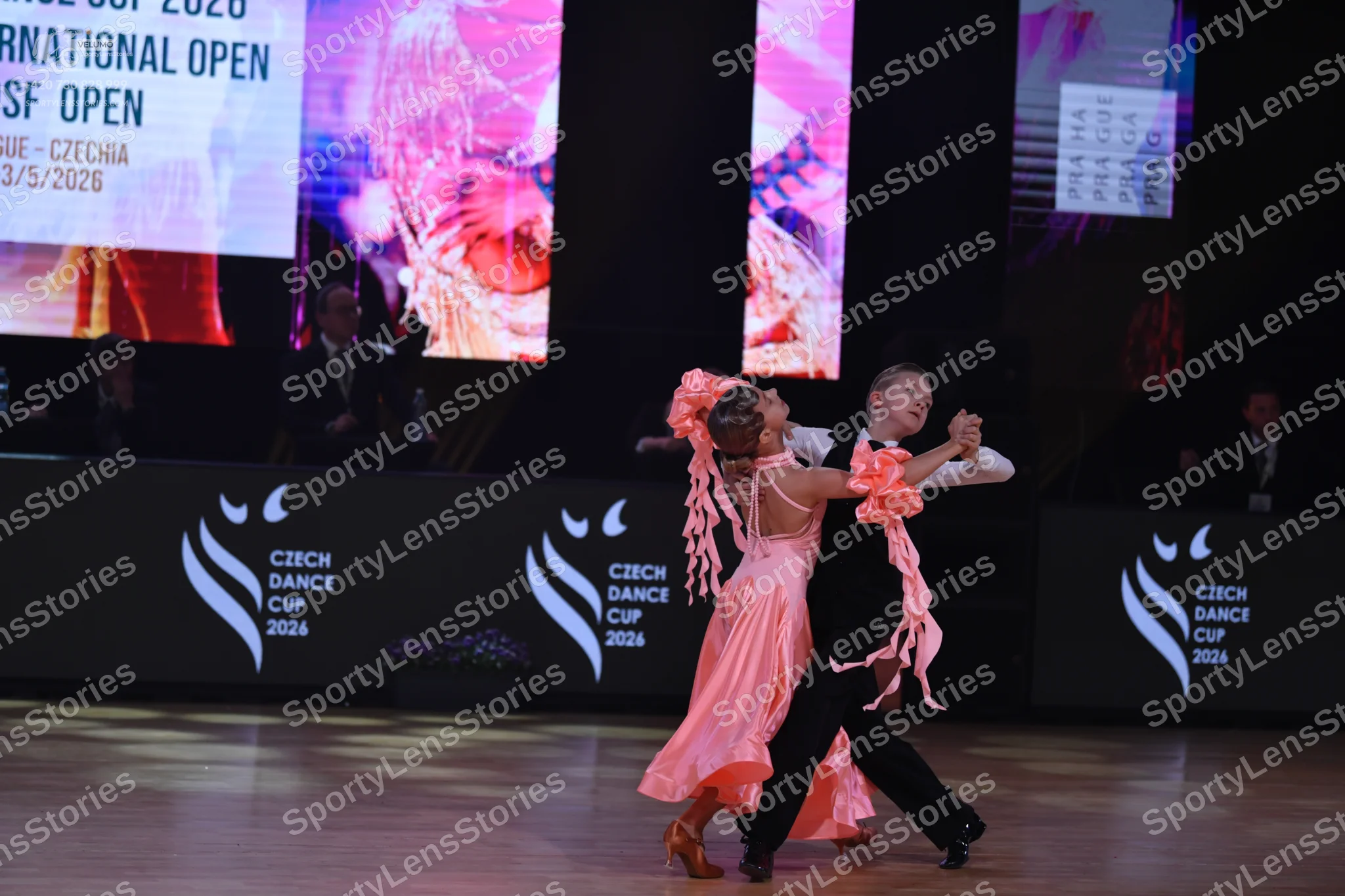 Dancesport competitor: Male dancer: black trousers and a white long-sleeved shirt