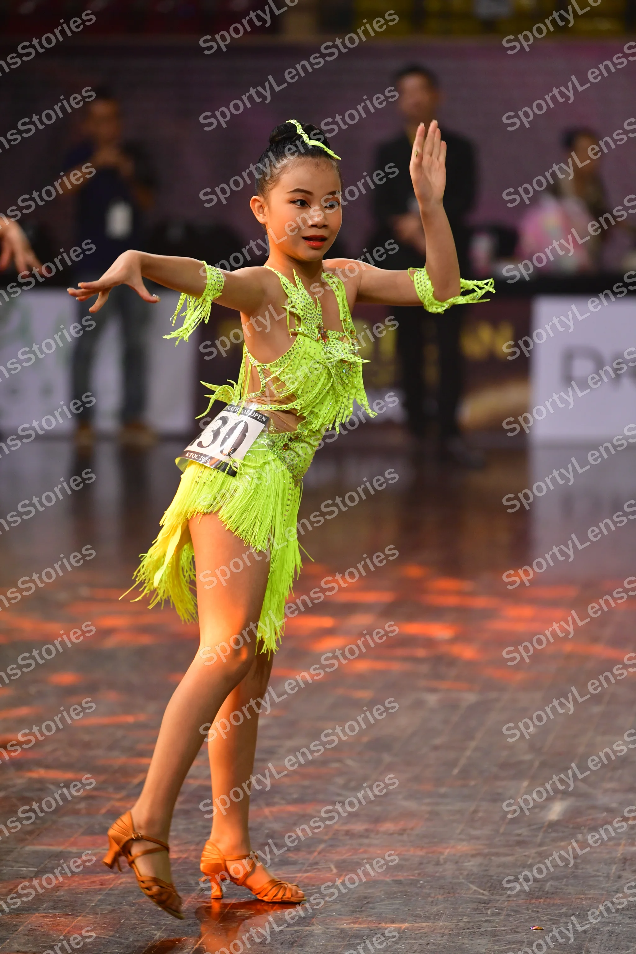 Dancesport competitor #301: Female dancer: neon yellow/lime green latin dress with fringe