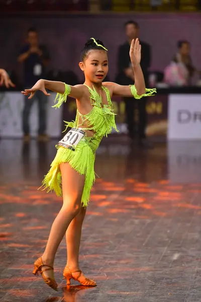 Dancesport competitor #301: Female dancer: neon yellow/lime green latin dress with fringe