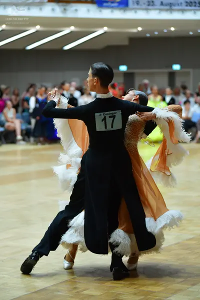 Dancesport competitor #17: Male dancer: black long-sleeved top and black trousers