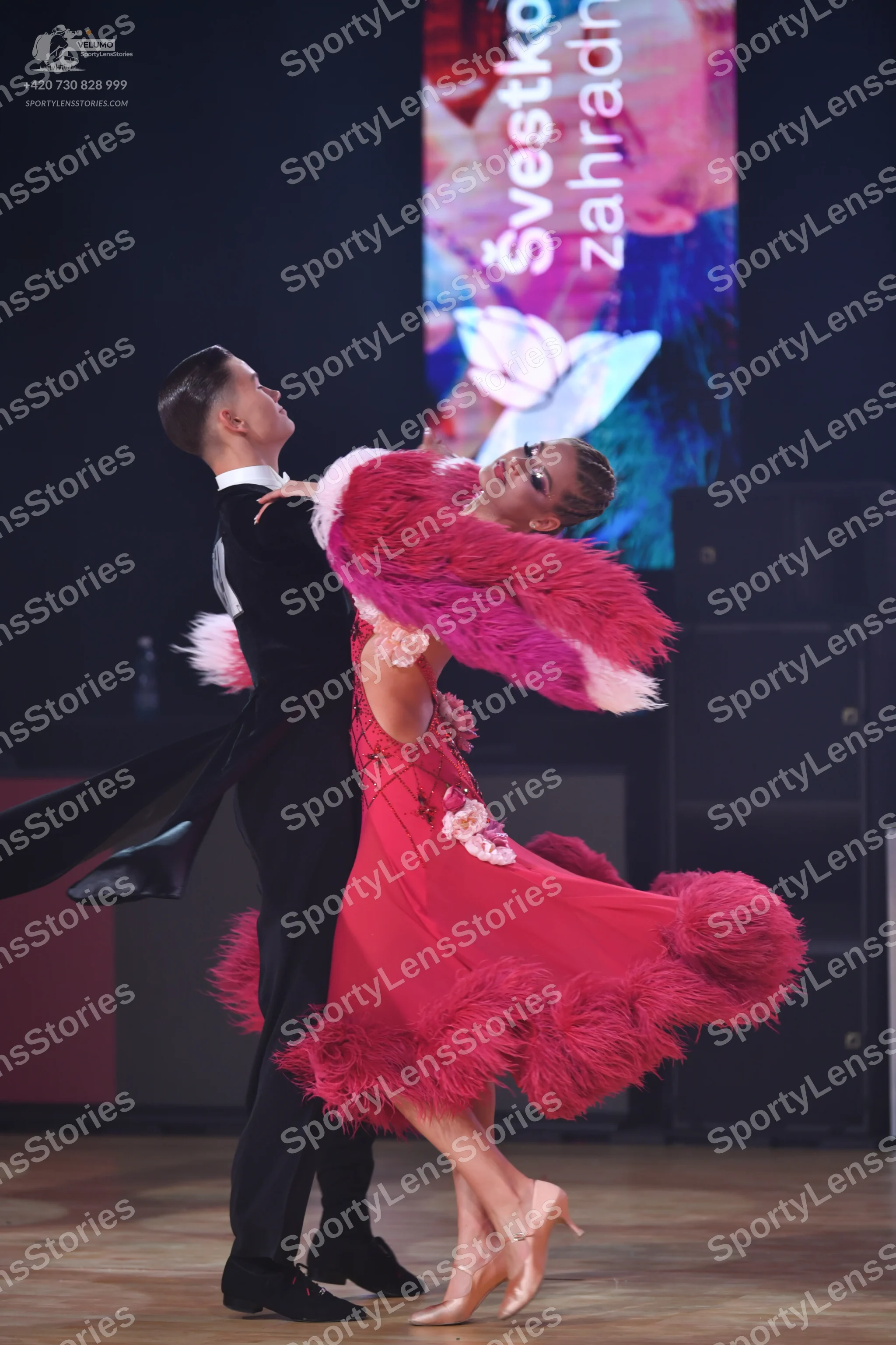 Dancesport competitor: Male dancer: black tuxedo-style suit with a white shirt and black bow tie