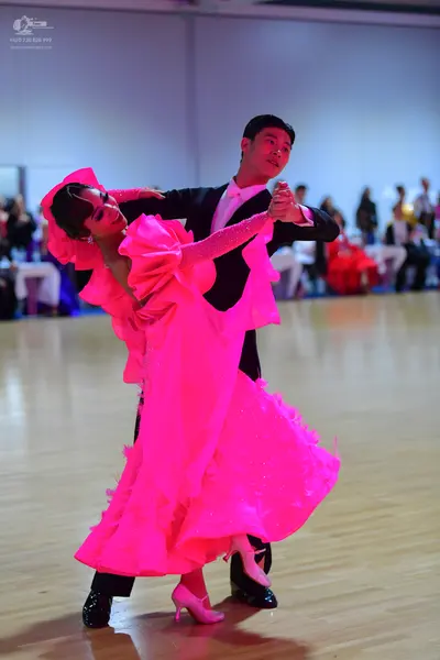 Dancesport competitor: Male dancer: black suit with a white shirt
