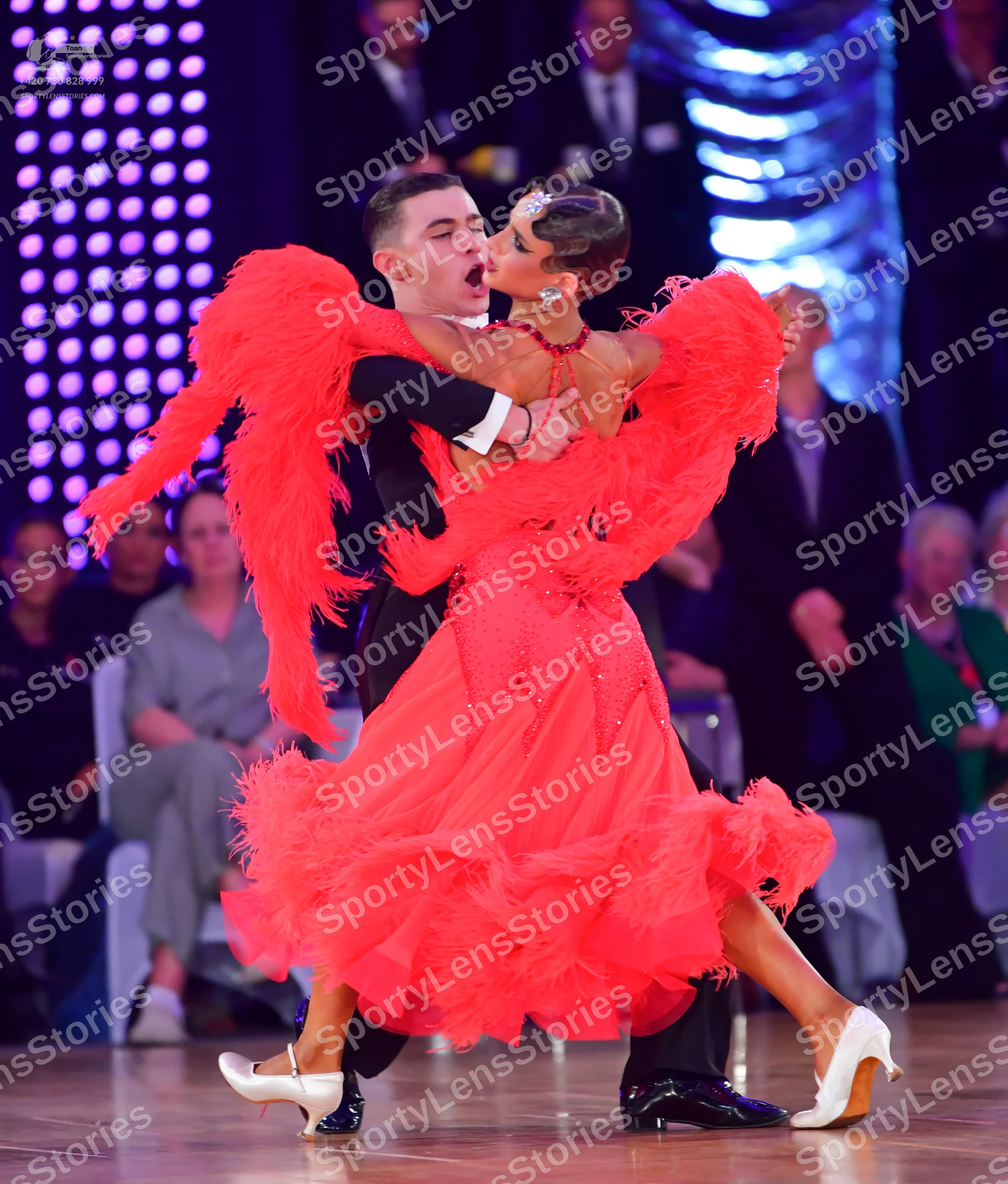 Dancesport competitor: Male dancer: black suit with white shirt and black bow tie