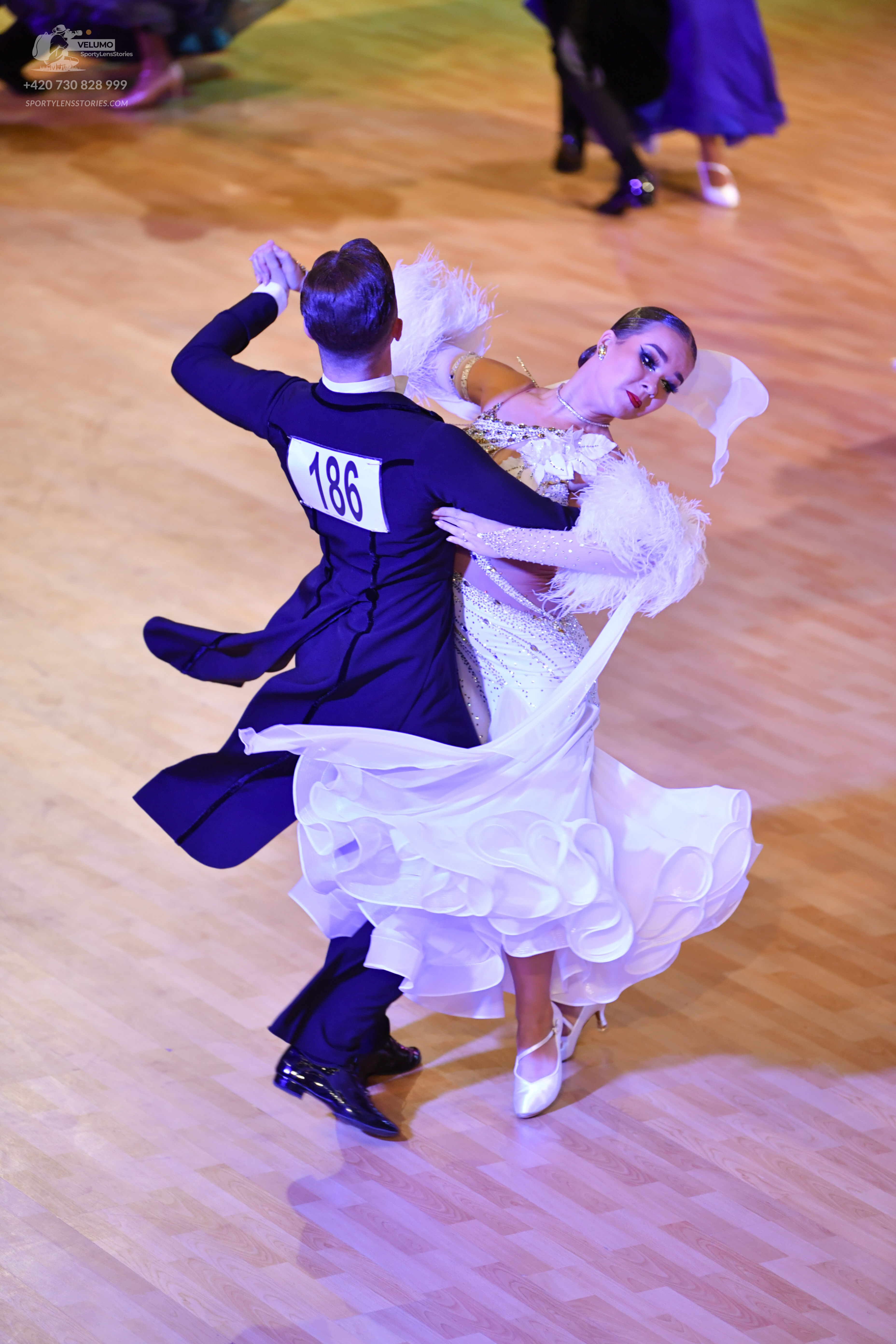 Dancesport competitor: ** Black ballroom suit