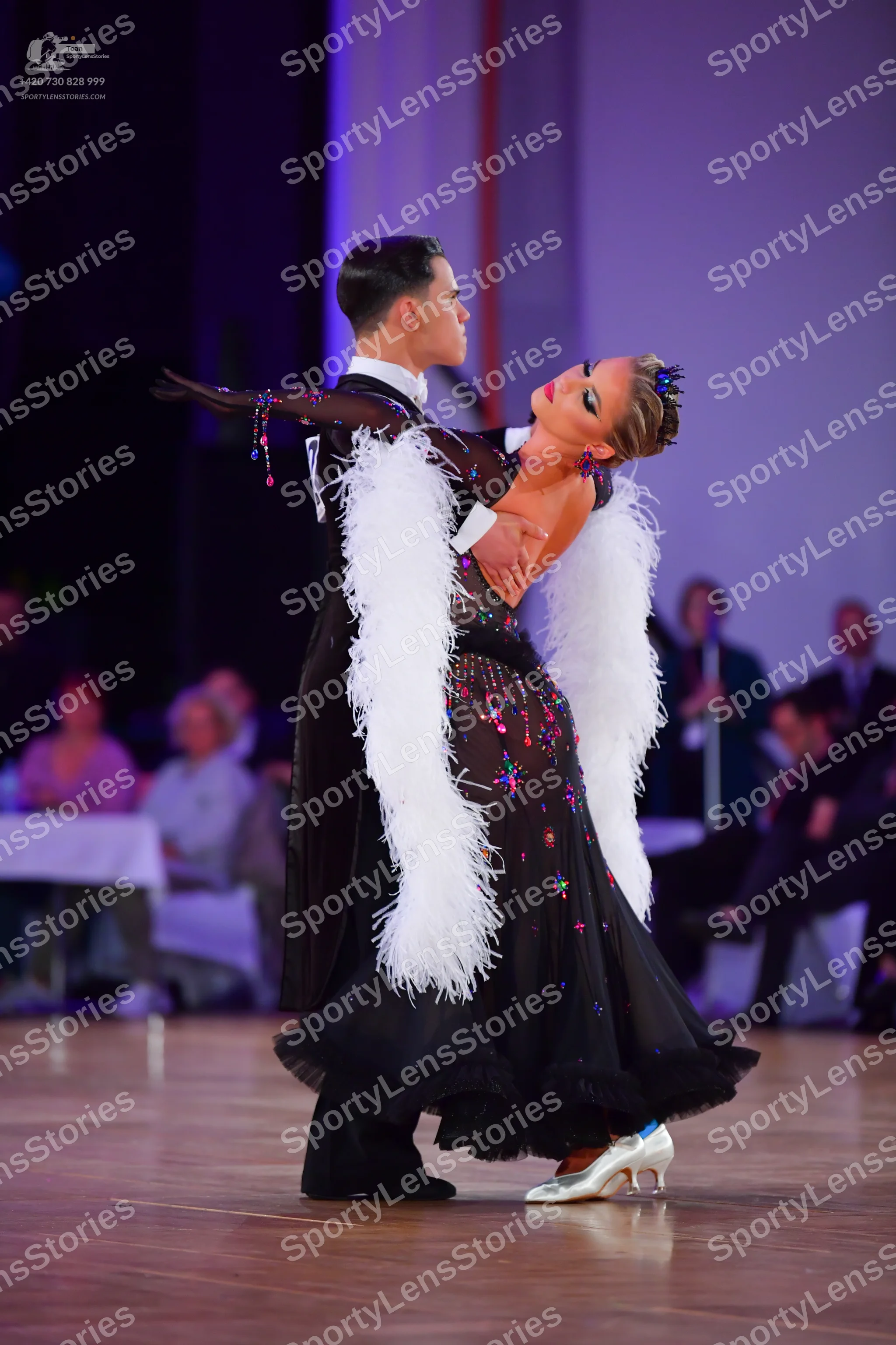 Dancesport competitor: Male dancer: black formal ballroom suit with a white shirt