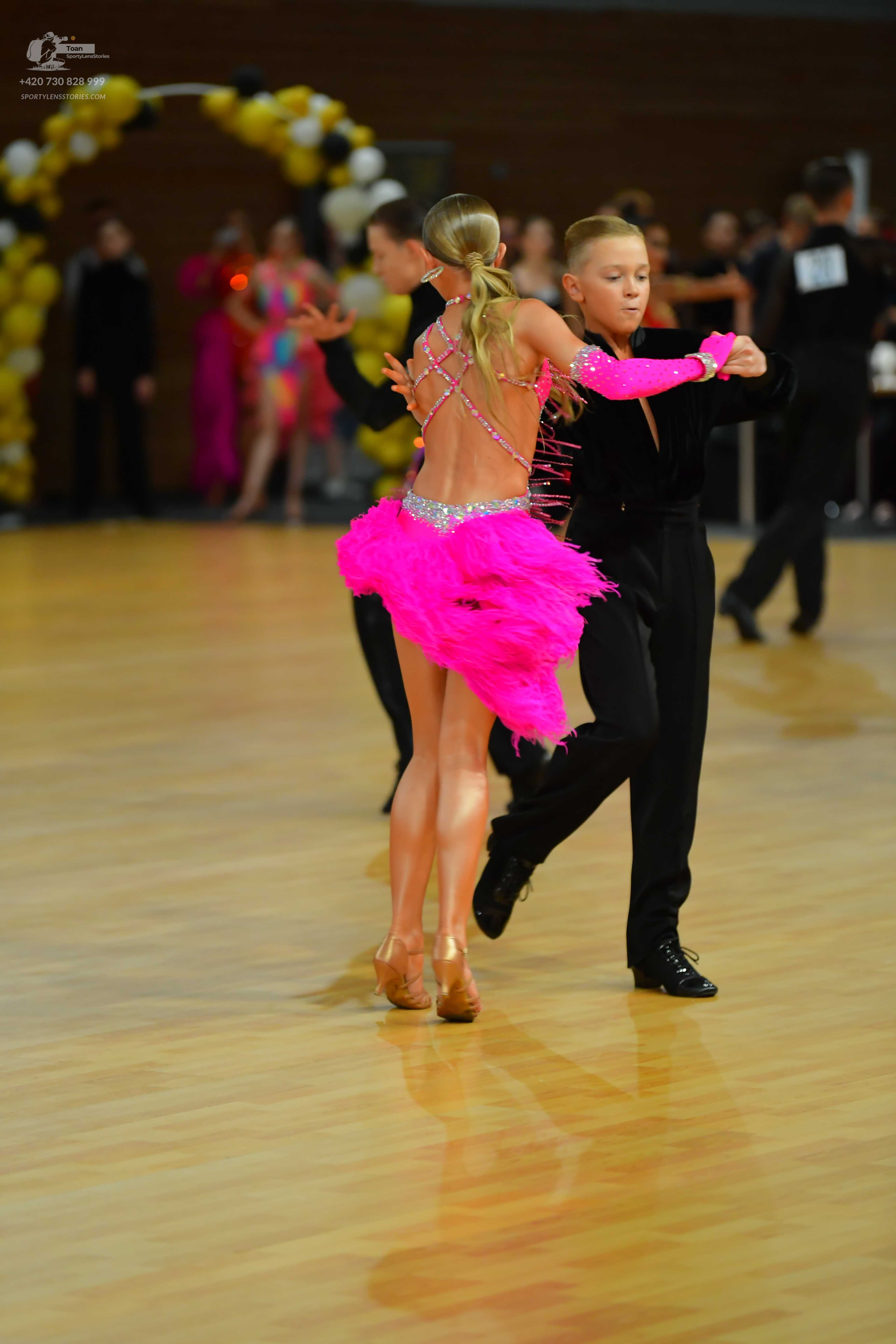 Dancesport competitor: ** Red Latin Dress
*   **Color:** Predominantly red, with pink accents