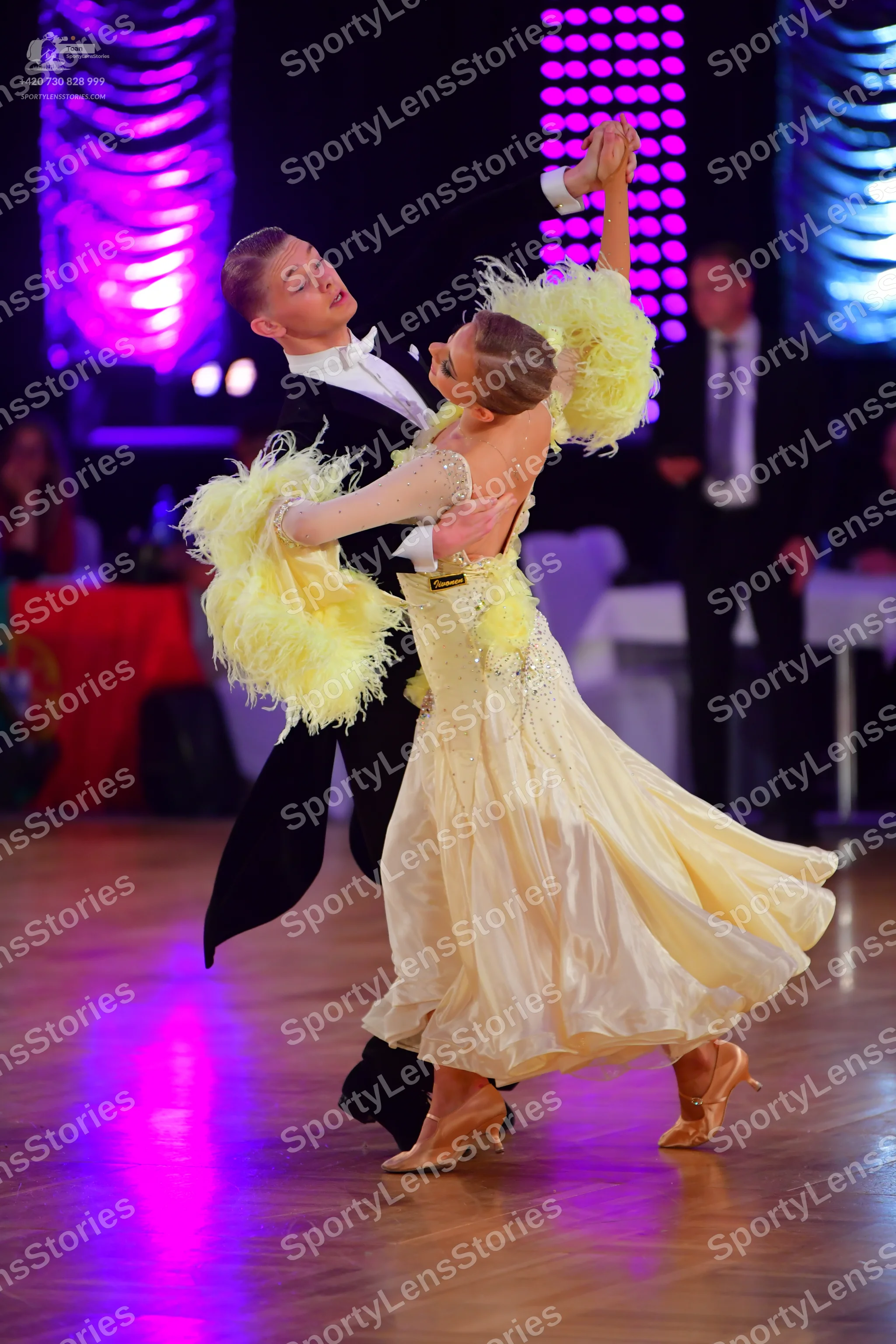 Dancesport competitor: Male dancer: black suit with a white shirt and white bow tie