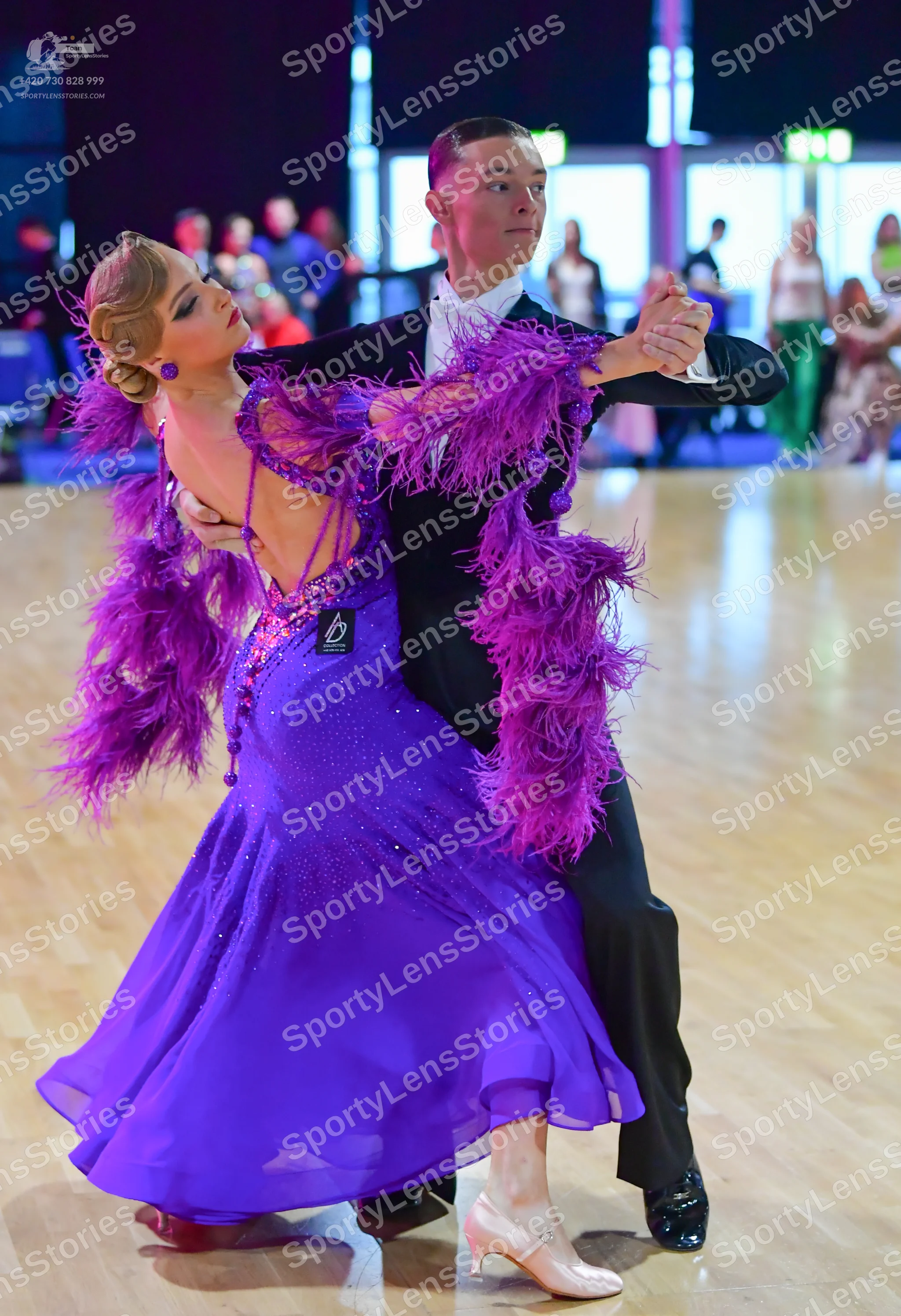 Dancesport competitor: Male dancer: black suit with a white shirt and white bowtie