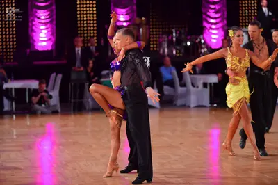 Dancesport competitor: Male dancers: black long-sleeved shirts and black trousers