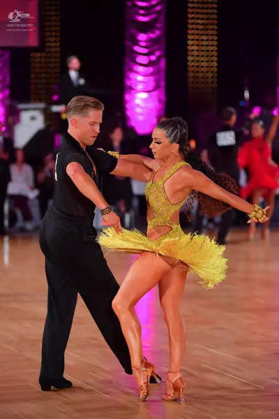 Dancesport competitor: Male dancer: black shirt and black trousers