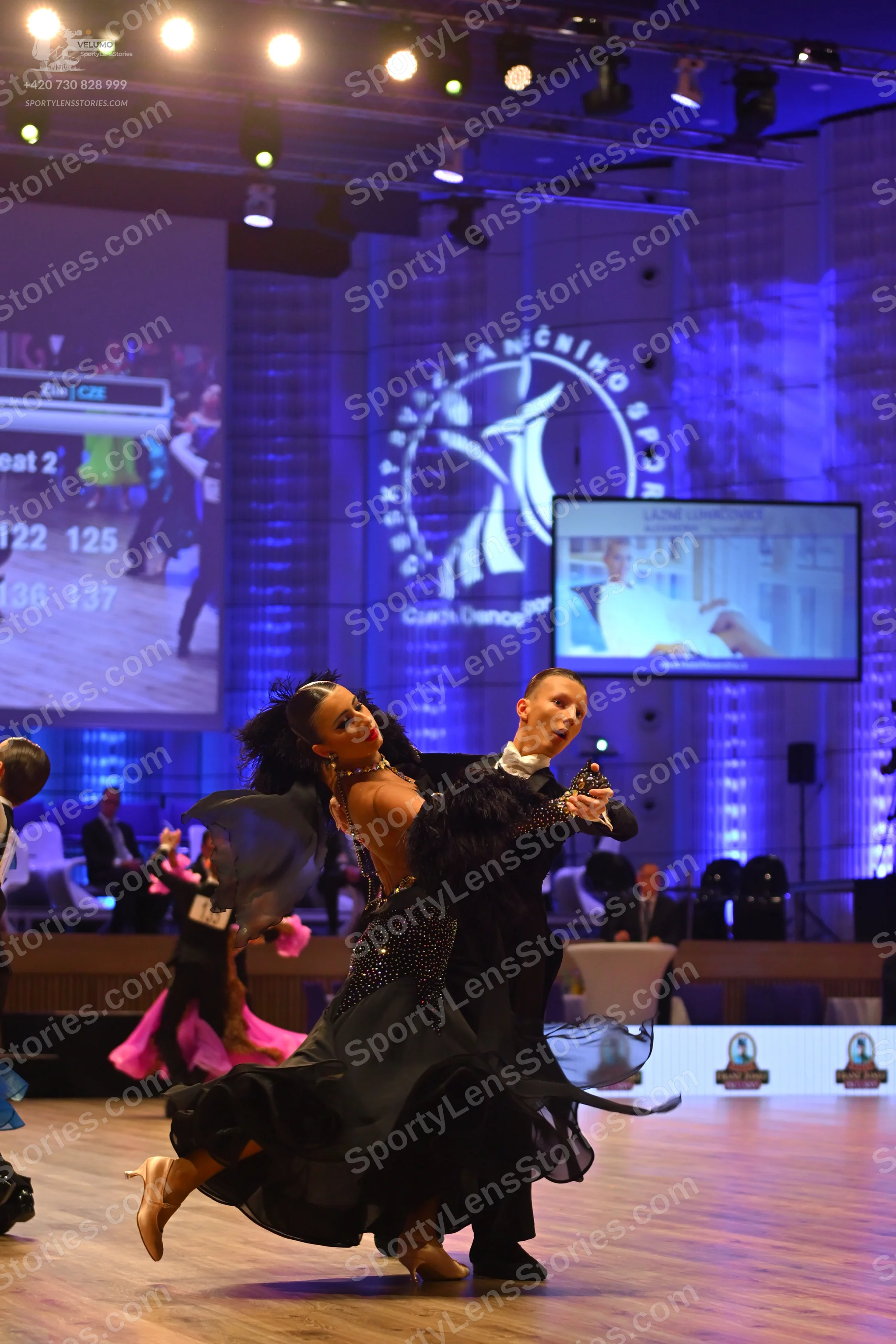 Dancesport competitor: Male dancer: black suit with a white shirt and black bow tie