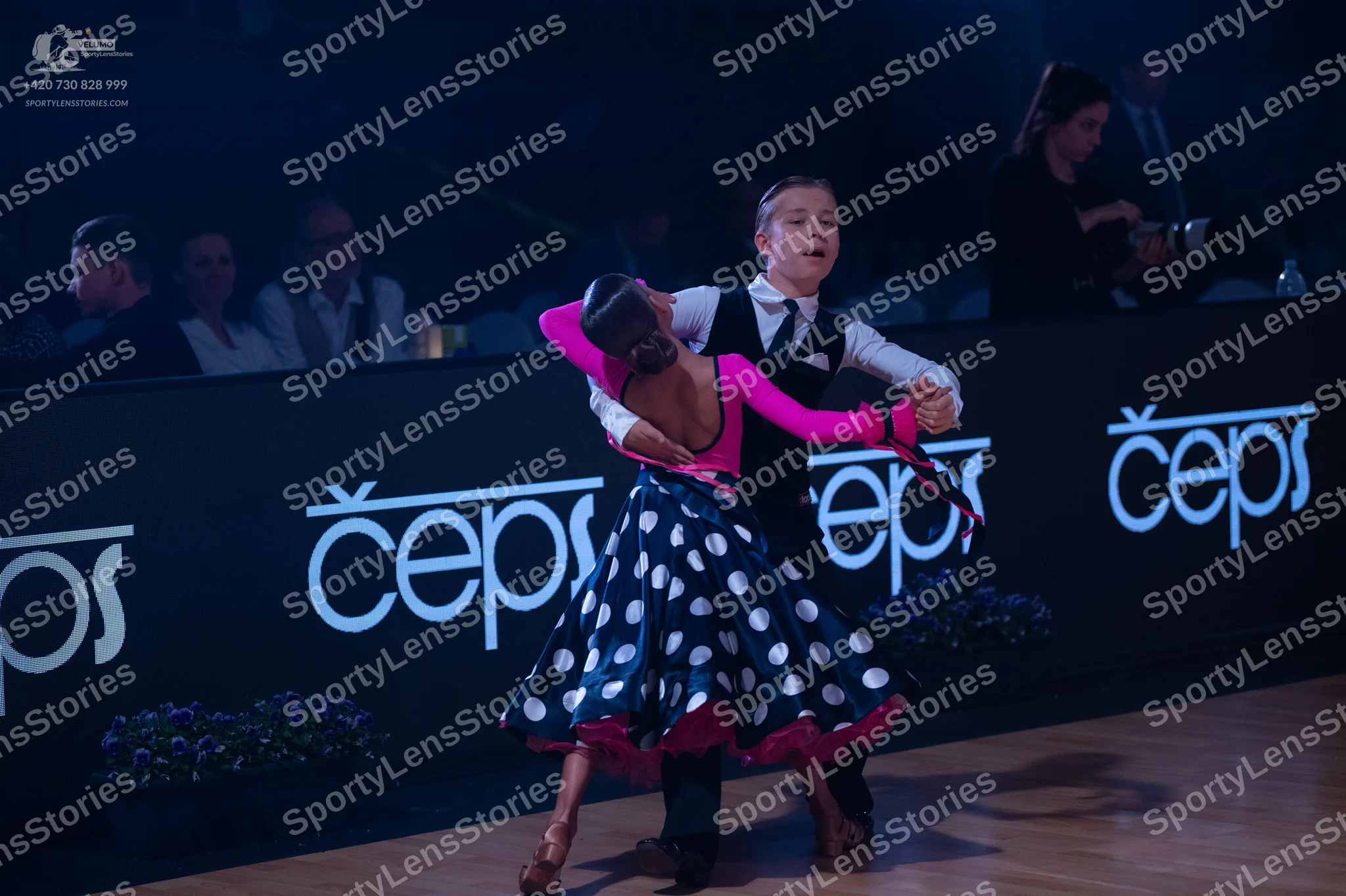 Dancesport competitor: Male dancer: white shirt, black waistcoat, black necktie, and black trousers