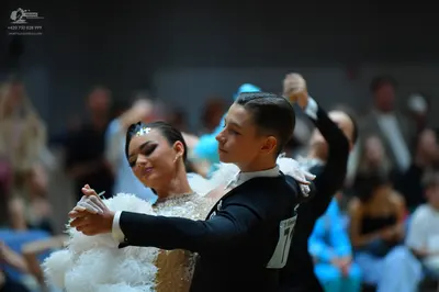 Dancesport competitor: Male dancer: black suit jacket