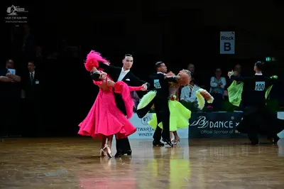 Dancesport competitor #100: Male dancers: black suits with white shirts