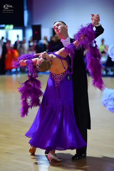 Dancesport competitor: Male dancer: black suit with a white shirt