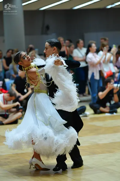 Dancesport competitor: Male dancer: black suit