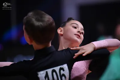 Dancesport competitor: Male dancer: black long-sleeved shirt