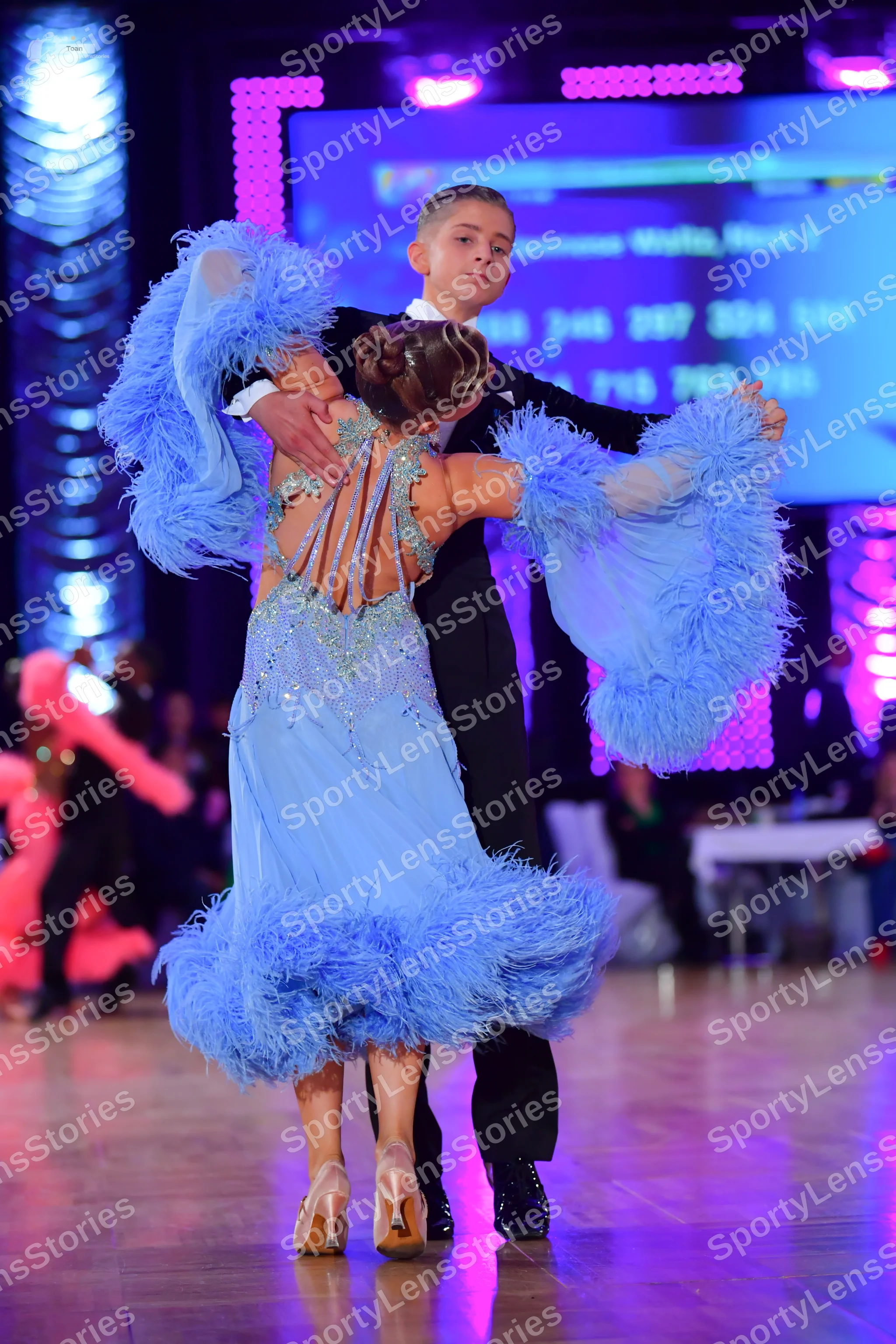 Dancesport competitor: Male dancer: black suit with a white shirt and black bow tie