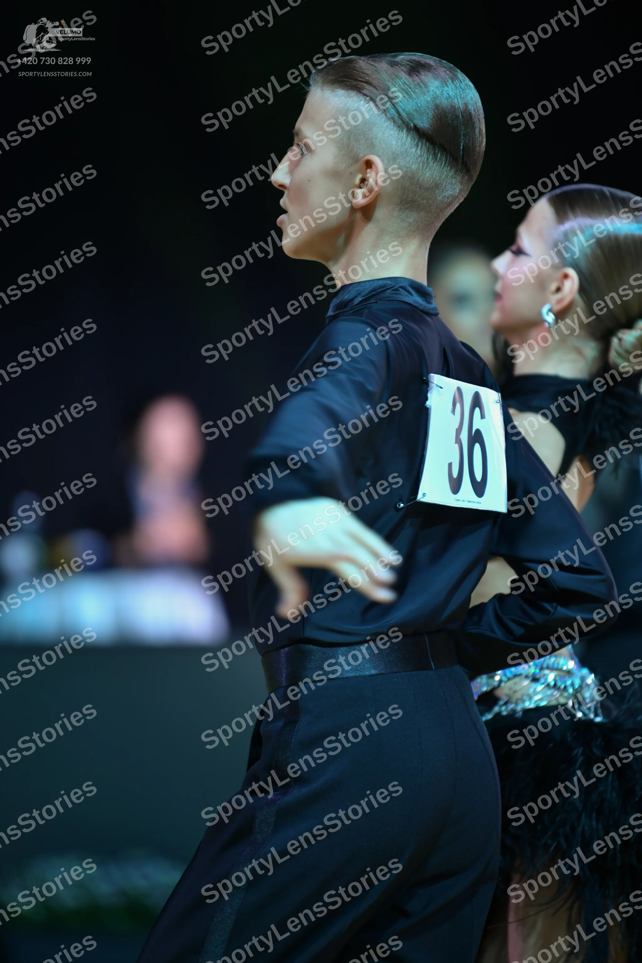 Dancesport competitor: Male dancer: black long-sleeve shirt and black trousers