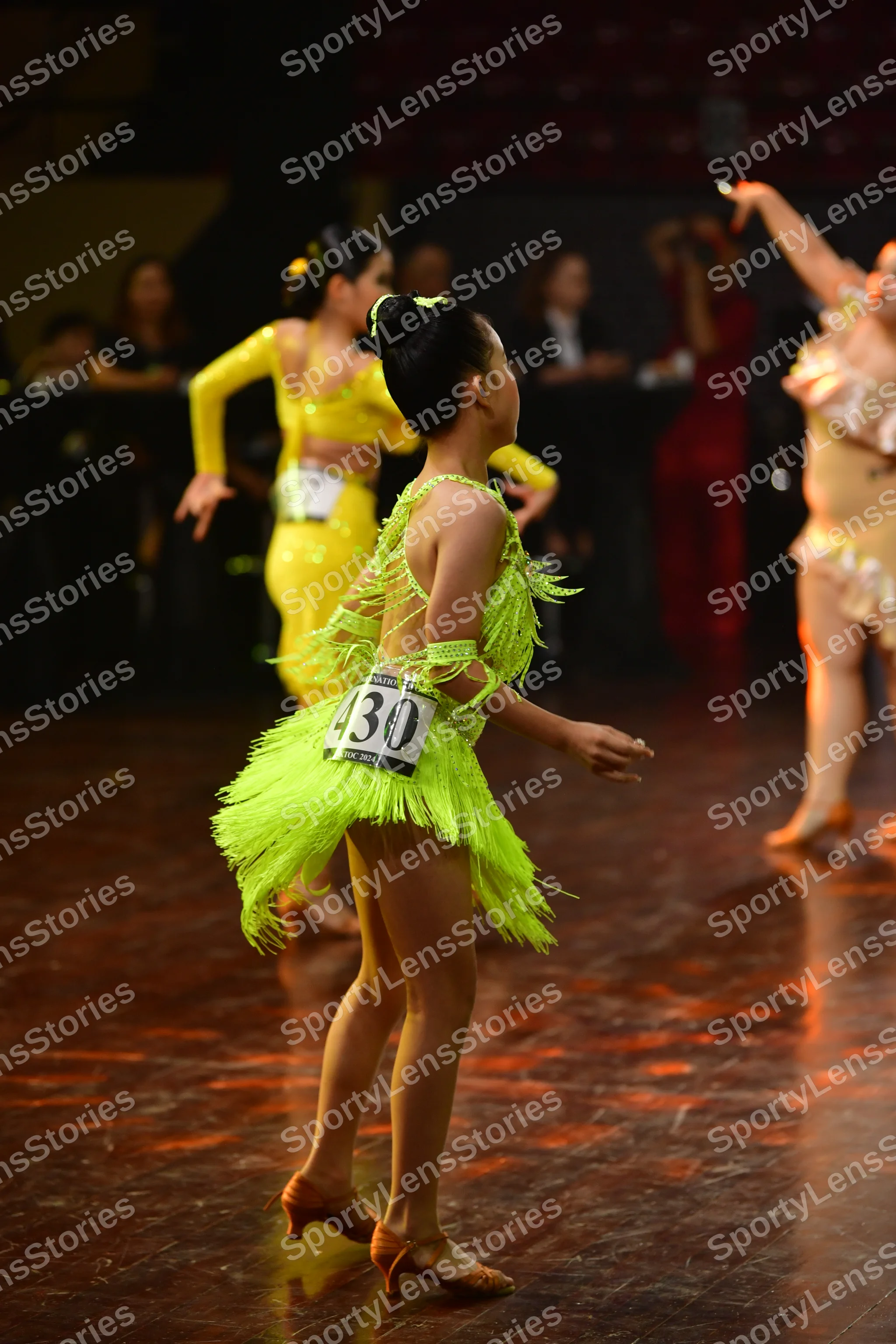 Dancesport competitor #30: Female dancer 1: lime green Latin dance dress with fringe