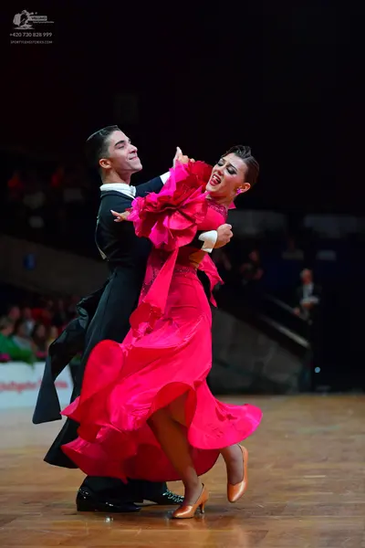 Dancesport competitor: Male dancer: black formal suit with a white shirt