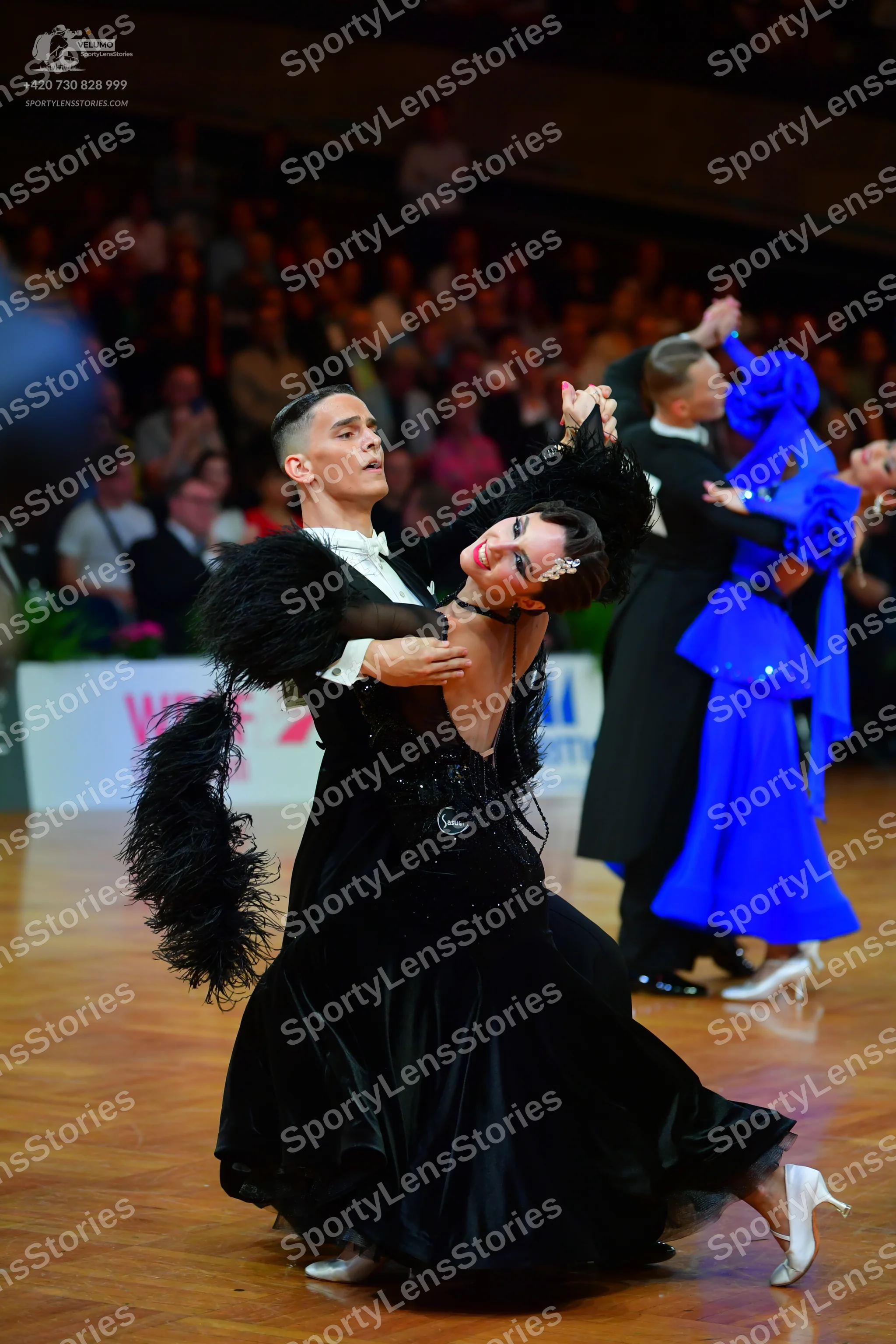 Dancesport competitor: Male dancer: black suit with white shirt and black bowtie