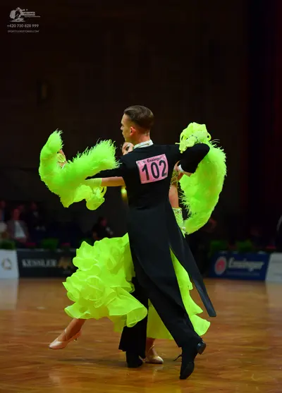 Dancesport competitor: Male dancer: black long-sleeved top and black trousers