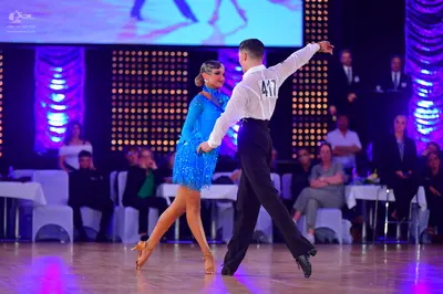 Dancesport competitor #417: Male dancer: white long-sleeved shirt and black trousers