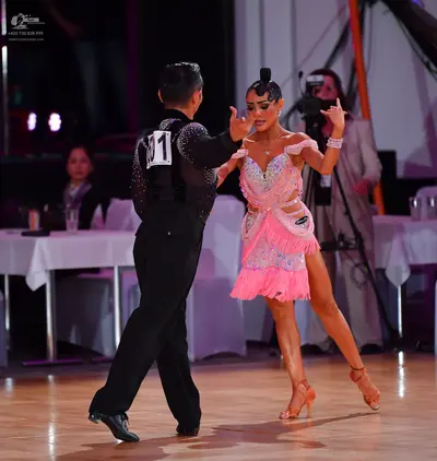Dancesport competitor #31: Male dancer: black long-sleeved shirt with subtle sequin embellishments, black t