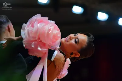 Dancesport competitor: Male dancer: black suit