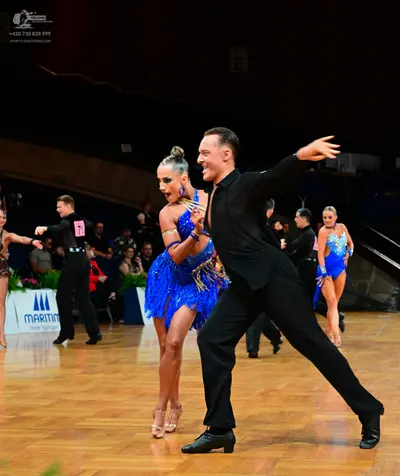 Dancesport competitor #45: Male dancer: black long-sleeved shirt and black trousers